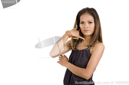 Image of young woman with call me sign