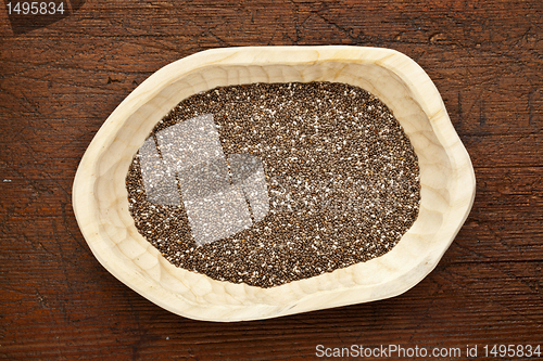 Image of chia seeds in a rustic bowl