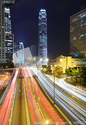 Image of traffic through downtown at night