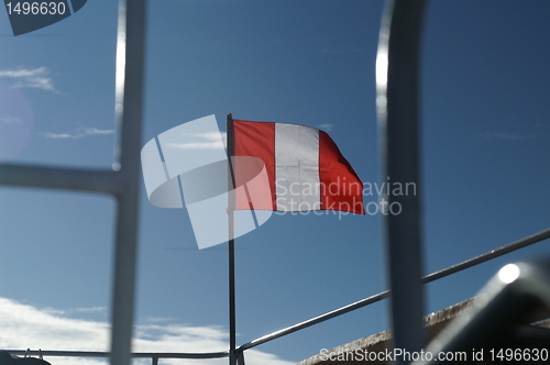 Image of Peru flag on Titicaca lake