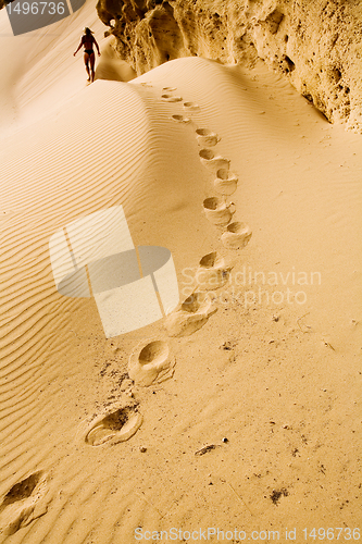 Image of footprints on the sand