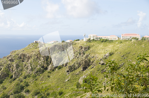 Image of typical houses on cliff mountain over Caribbean Sea Saba Dutch N