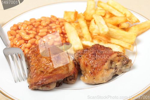 Image of lemon chicken fries and beans meal