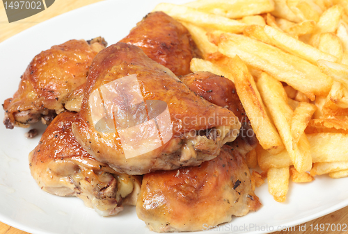 Image of Roast lemon chicken thighs and fries