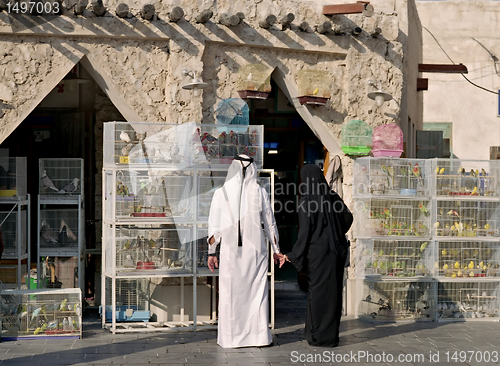 Image of Qatari couple in bird souq