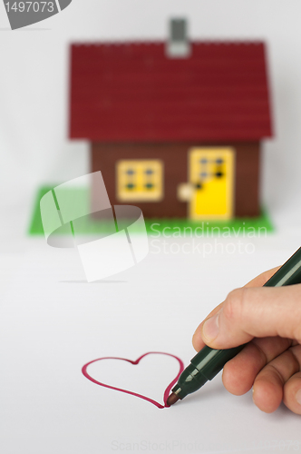 Image of Hand write painting heart and house on background.