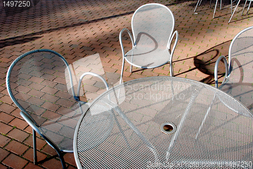 Image of Silvery metal table and chairs 