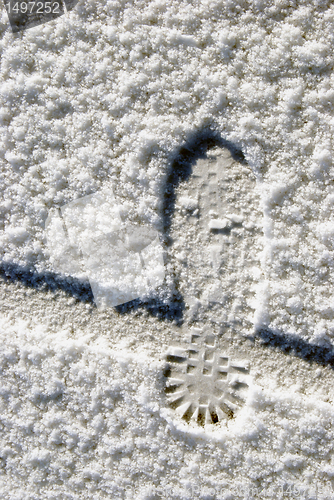 Image of Human foot and bicycle wheel imprint 