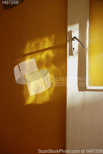 Image of White door yellow  wall 