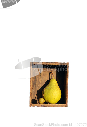 Image of Big and small pears in old box 