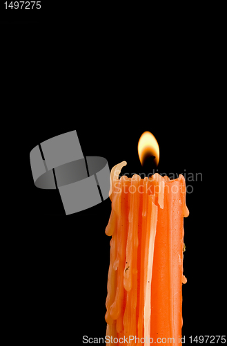 Image of Burning orange candle 