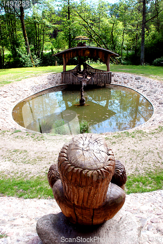 Image of Round cobbly stoned pond 