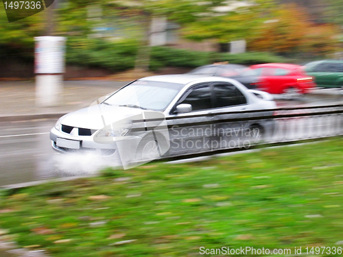 Image of car on a wet road 