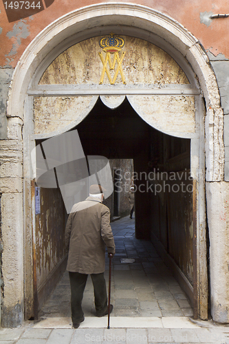 Image of Old man walking, Venice.