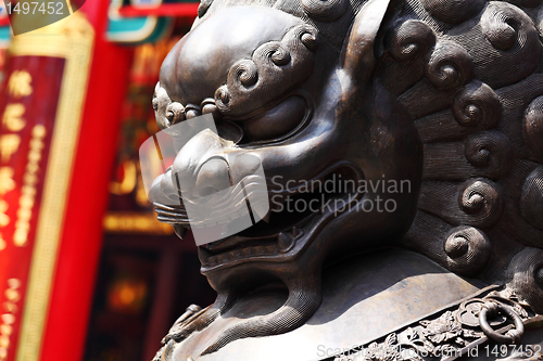 Image of Bronze lion in chinese temple