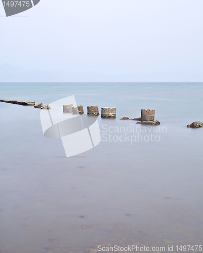 Image of broken stone bridge on sea