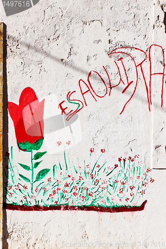 Image of Graffiti on the white wall in Essaouira