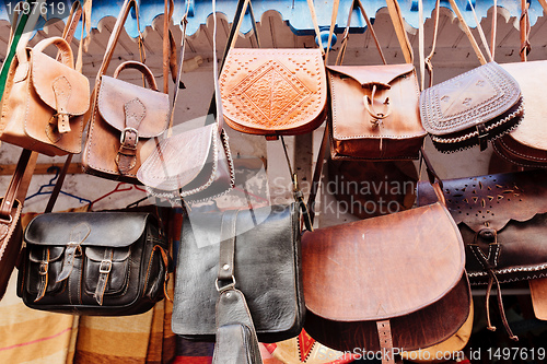 Image of Leather bags in a market in the street