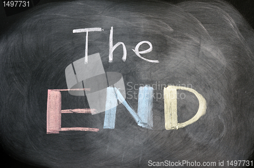 Image of The end - handwritten with chalk on a blackboard with eraser smudges 