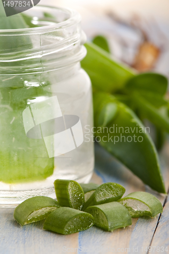 Image of aloe vera juice with fresh leaves