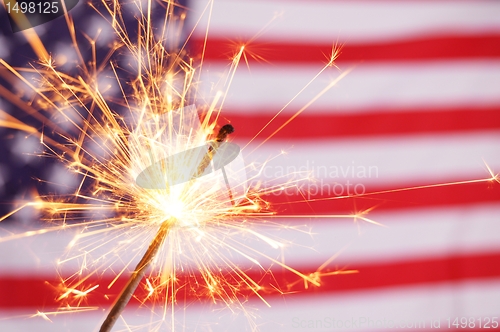 Image of sparkler and usa flag