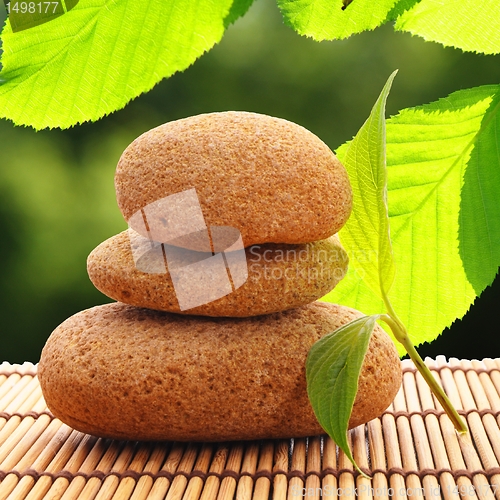 Image of zen stone with leaf