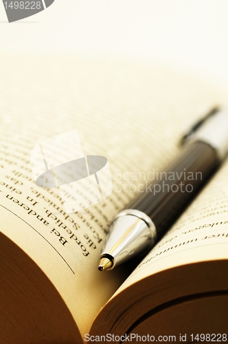 Image of book and pen
