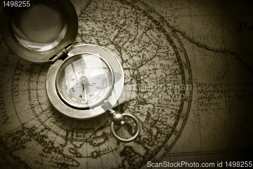 Image of old compass on vintage map