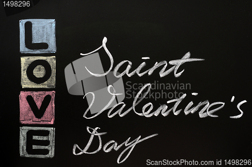 Image of Love drawn in chalk on a chalkboard 