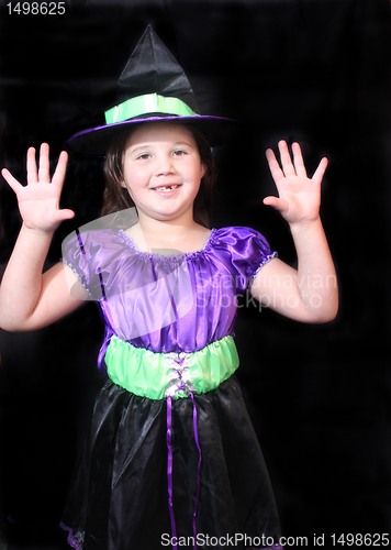 Image of Halloween witch with arms up
