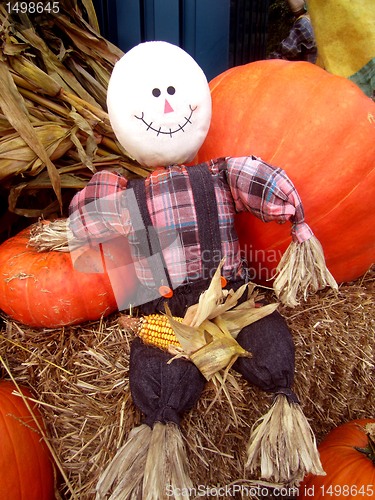 Image of Fall scarecrow with pumpkins