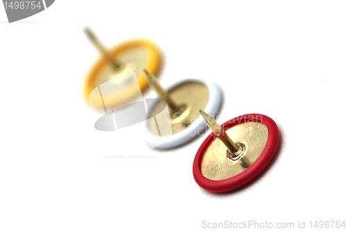 Image of red,yellow and white thumbtack