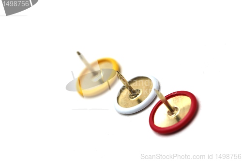 Image of red,yellow and white thumbtack