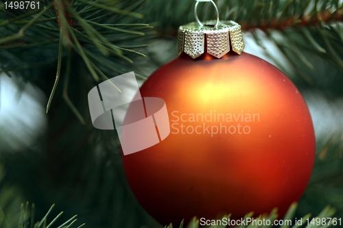 Image of orange sphere on christmas tree