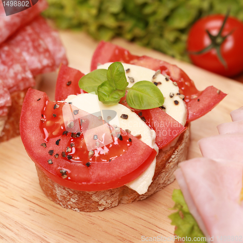 Image of Fingerfood with mozzarella cheese and tomatoes