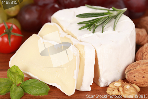 Image of Still life with Camembert cheese cut on slices