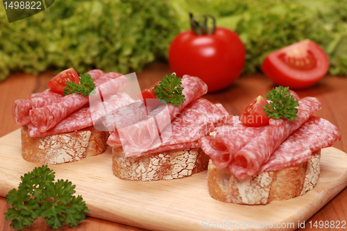 Image of Fingerfood with salami and tomatos