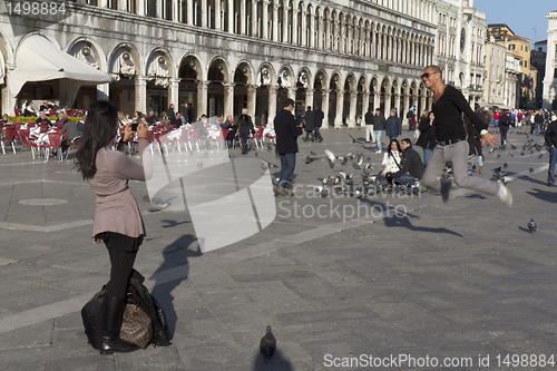 Image of A tourist is jumping up