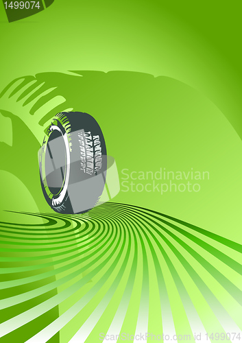 Image of Brand new tire on a green background