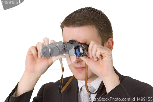 Image of Young businessman with binoculars