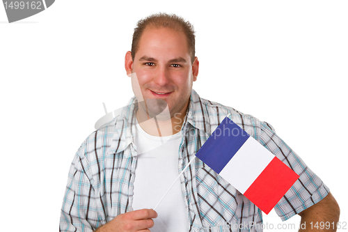 Image of Young man holding french flag