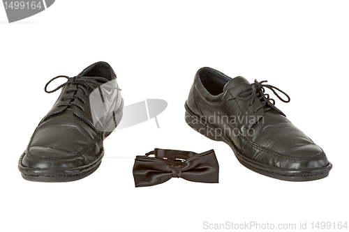 Image of Man's shoe and bow tie