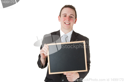 Image of Businessman holding a blackboard