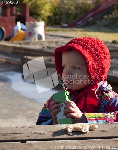 Image of Child enjoying kindergarten lunch outdoors