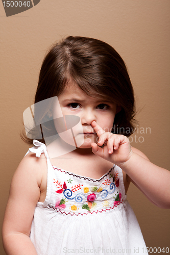 Image of Toddler with finger in nose