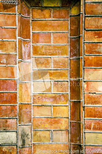 Image of Old ancient gate made of red brick background.