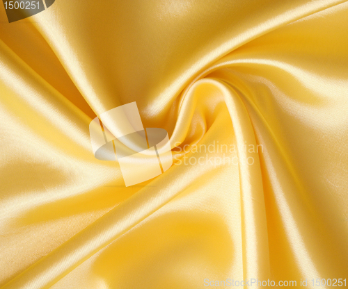 Image of Smooth elegant golden satin as background 