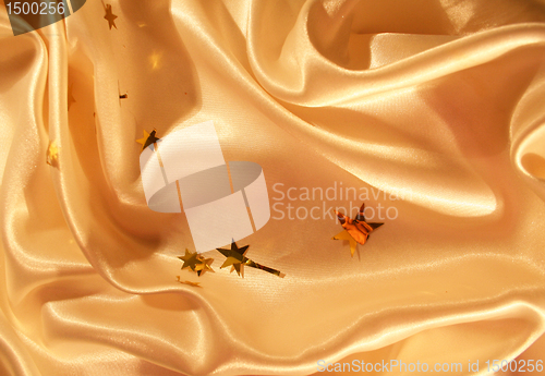 Image of New year holiday golden satin as background 