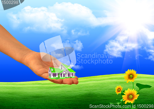 Image of small house on a hand
