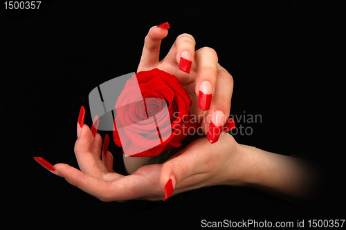 Image of Human fingers with long fingernail and beautiful manicure isolated on black